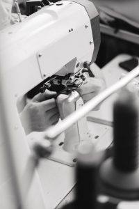 man setting up sewing machine
