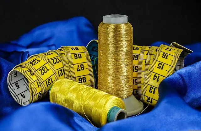 golden threads with measuring tape 