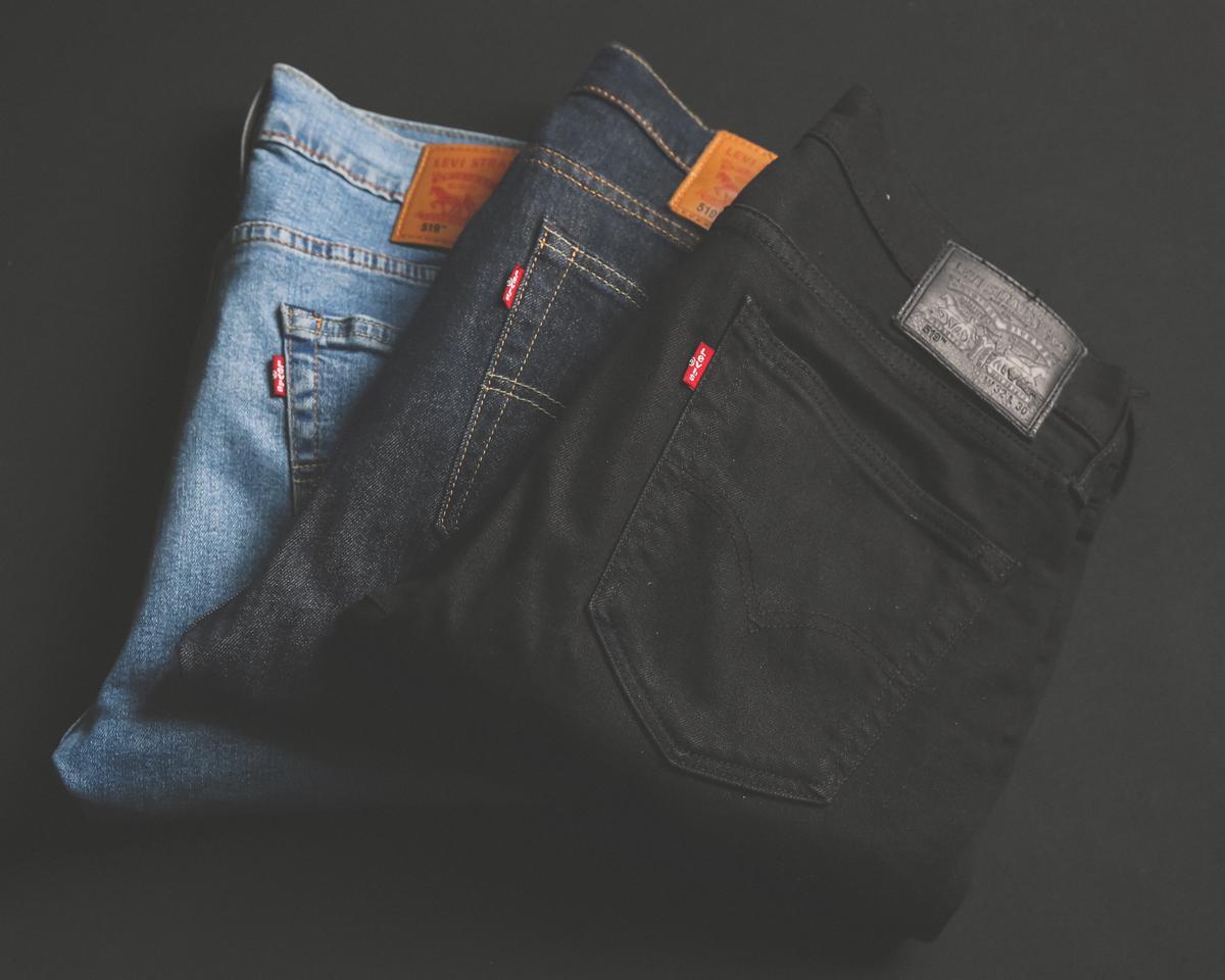 A pair of original hem jeans showcasing their unique and distressed look.